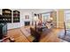 Spacious living room with built-in bookshelves, a fireplace, and plush leather seating at 1005 Brookview Dr, Elon, NC 27244