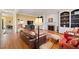 Comfortable living room with a fireplace, built-in shelving, and hardwood floors at 1005 Brookview Dr, Elon, NC 27244