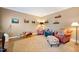 Cozy living room with neutral walls, comfortable seating, a jute rug, and charming decorative accents at 1005 Brookview Dr, Elon, NC 27244