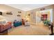 Comfortable living room with cozy armchairs, jute rug, and decorative shelves, creating a relaxing space at 1005 Brookview Dr, Elon, NC 27244