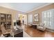 Bright office with a modern desk, comfortable seating, and views of the foyer, creating a functional workspace at 1005 Brookview Dr, Elon, NC 27244