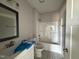 Bathroom features a white vanity, stylish mirror and combination shower and tub at 102 Ruskin Dr, Smithfield, NC 27577