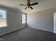 Bright bedroom with neutral walls, plush carpeting, and natural light from the windows at 102 Ruskin Dr, Smithfield, NC 27577
