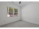 Cozy bedroom with a large window offering a view of the natural surroundings at 111 Halifax Rd, Louisburg, NC 27549