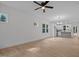 Spacious living area with light wood floors and lots of natural light from adjacent kitchen at 111 Halifax Rd, Louisburg, NC 27549