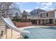 Expansive backyard featuring an in-ground pool, slide and multi-level deck, perfect for entertaining at 111 San Juan Dr, Chapel Hill, NC 27514