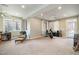 Spacious basement with carpet, natural light, and exercise equipment at 111 San Juan Dr, Chapel Hill, NC 27514