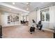 Basement features a built-in bookcase and large windows at 111 San Juan Dr, Chapel Hill, NC 27514
