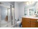 Well-lit bathroom featuring a glass shower, vanity, and toilet at 111 San Juan Dr, Chapel Hill, NC 27514