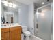 A well-lit bathroom featuring a glass shower, toilet and vanity at 111 San Juan Dr, Chapel Hill, NC 27514