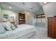 Comfortable bedroom with vaulted ceilings, built-in bookcase, and cozy carpet at 111 San Juan Dr, Chapel Hill, NC 27514