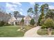 Charming two-story home with manicured lawn, mature trees, and inviting curb appeal at 111 San Juan Dr, Chapel Hill, NC 27514
