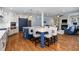 Open-concept kitchen with a large island, seating, and hardwood floors at 111 San Juan Dr, Chapel Hill, NC 27514