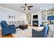 Cozy living room featuring a fireplace, plush seating, and a stylish area rug at 111 San Juan Dr, Chapel Hill, NC 27514