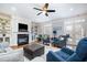Inviting living room with fireplace, built-in shelving, and French doors to the outside at 111 San Juan Dr, Chapel Hill, NC 27514