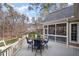 Relaxing screened porch with stylish dining table and chairs, perfect for outdoor enjoyment at 111 San Juan Dr, Chapel Hill, NC 27514