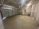 Spacious and unfinished two car garage with concrete floor and drywall at 11778 Salers Loop, Middlesex, NC 27557