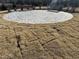 Stone patio in newly constructed backyard with developing grass and bench seating at 11778 Salers Loop, Middlesex, NC 27557