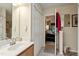 Bright bathroom with a vanity and doorway leading to a bedroom at 11821 Fairlie Pl, Raleigh, NC 27613