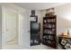 Bedroom featuring a bookshelf and TV at 11821 Fairlie Pl, Raleigh, NC 27613
