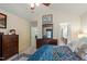 Bedroom with a vaulted ceiling, carpet, and dark wood furniture opens to a view of the bathroom at 11821 Fairlie Pl, Raleigh, NC 27613