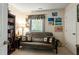 Cozy bedroom featuring a futon, bookshelf, and ample natural light at 11821 Fairlie Pl, Raleigh, NC 27613