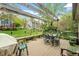 Outdoor deck area with a wooden pergola, table and chairs, perfect for entertaining at 11821 Fairlie Pl, Raleigh, NC 27613