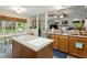 Kitchen with a dining nook and stainless steel dishwasher and a breakfast bar at 11821 Fairlie Pl, Raleigh, NC 27613