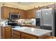 Well-equipped kitchen with stainless steel appliances, ample cabinetry and counter space for meal prep at 11821 Fairlie Pl, Raleigh, NC 27613