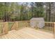 View of a backyard deck overlooking a large green yard with a storage shed in the distance at 120 Renee Dr, Wilson's Mills, NC 27577