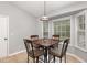Bright dining area with a bay window, table with four chairs, and neutral decor at 120 Renee Dr, Wilson's Mills, NC 27577