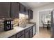 Updated kitchen with stainless steel sink, mosaic backsplash, and modern fixtures at 120 Renee Dr, Wilson's Mills, NC 27577