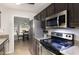 Modern kitchen with stainless steel appliances and dark wood cabinetry at 120 Renee Dr, Wilson's Mills, NC 27577