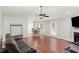 Open-concept living room flowing into the dining area, featuring a fireplace, and wood-look flooring at 120 Renee Dr, Wilson's Mills, NC 27577