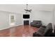 Spacious living room featuring a fireplace, vaulted ceilings, and wood-look flooring at 120 Renee Dr, Wilson's Mills, NC 27577