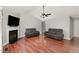 Cozy living room features a fireplace, vaulted ceilings, and two reclining sofas at 120 Renee Dr, Wilson's Mills, NC 27577
