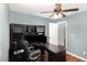 Home office with built-in desk, overhead storage, and modern decor at 120 Renee Dr, Wilson's Mills, NC 27577