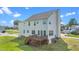 Back exterior view of the home featuring a wooden deck and siding at 1308 Aspen Falls Ct, Willow Springs, NC 27592