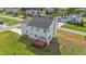 This home features a deck overlooking the green backyard at 1308 Aspen Falls Ct, Willow Springs, NC 27592