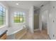 This bathroom features a soaking tub and separate shower at 1308 Aspen Falls Ct, Willow Springs, NC 27592