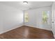 A bedroom featuring hardwood floors and natural light at 1308 Aspen Falls Ct, Willow Springs, NC 27592