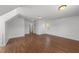 Bonus room with hardwood floors, neutral paint, and doorways at 1308 Aspen Falls Ct, Willow Springs, NC 27592