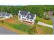This home features a large yard on a wooded lot with mature trees at 1308 Aspen Falls Ct, Willow Springs, NC 27592