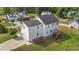 Aerial view of the home's side and back exterior featuring a lush green lawn at 1308 Aspen Falls Ct, Willow Springs, NC 27592