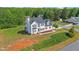 This two-story home is located on a large landscaped lot with mature trees at 1308 Aspen Falls Ct, Willow Springs, NC 27592
