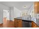 Open kitchen with stainless dishwasher overlooks spacious living room at 1308 Aspen Falls Ct, Willow Springs, NC 27592