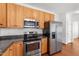 Modern kitchen featuring stainless steel appliances and plenty of countertop space for meal preparation at 1308 Aspen Falls Ct, Willow Springs, NC 27592