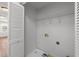 Laundry room with shelving and utility connections at 1308 Aspen Falls Ct, Willow Springs, NC 27592