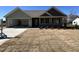 Charming one-story home featuring a spacious garage, covered porch, and beautifully landscaped front yard at 141 Ruskin Dr, Smithfield, NC 27577