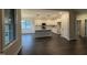 Modern kitchen with white cabinets, granite countertops, stainless appliances, and dark hardwood floors at 141 Ruskin Dr, Smithfield, NC 27577